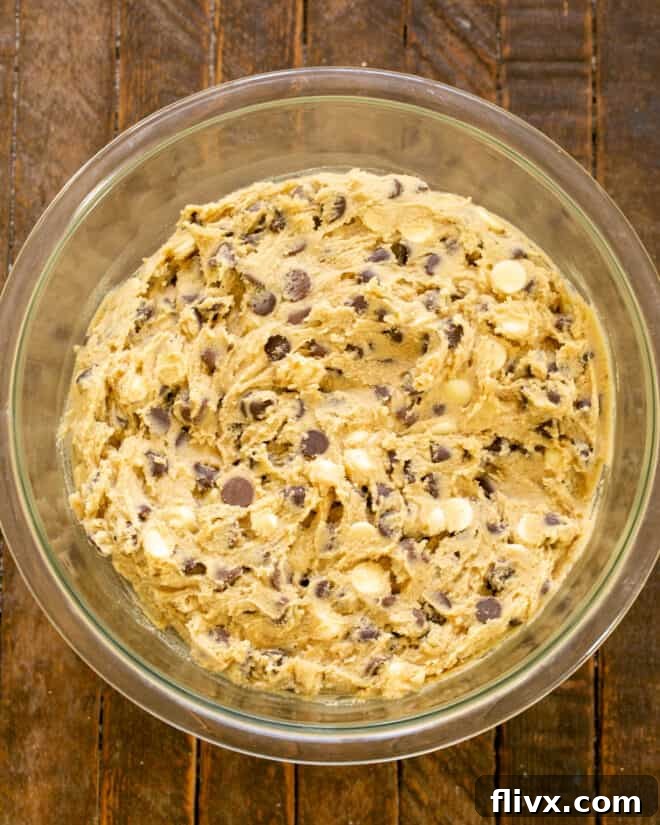 Step 5: Mixing the chocolate chip cookie dough well until all ingredients are incorporated.