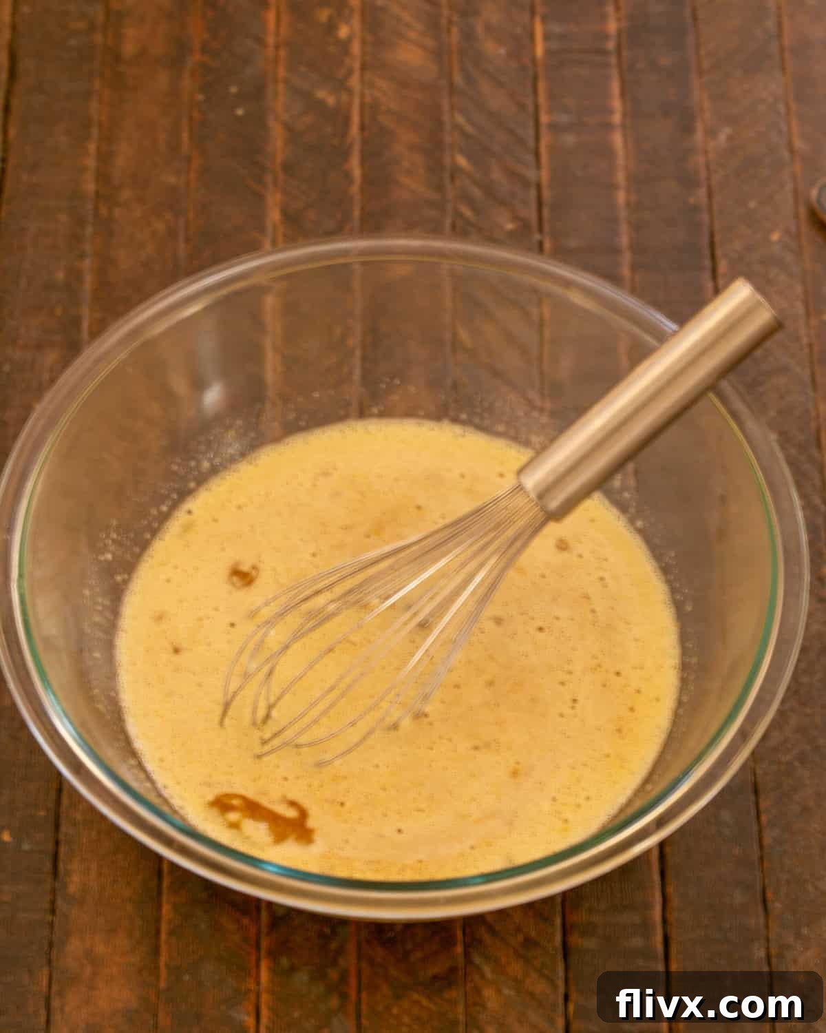 Step 3: Whisking eggs, instant coffee, vanilla extract, and sugar in a separate bowl.