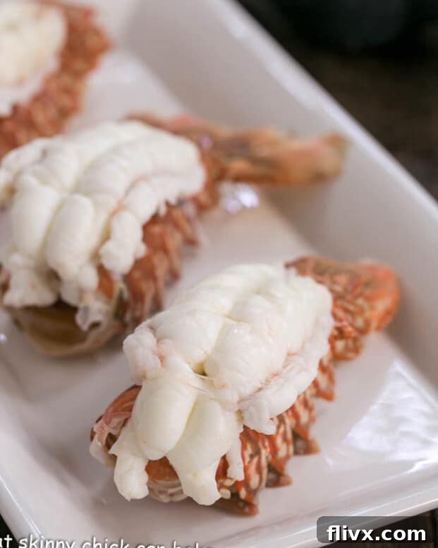 Cooked lobster tails on a white tray
