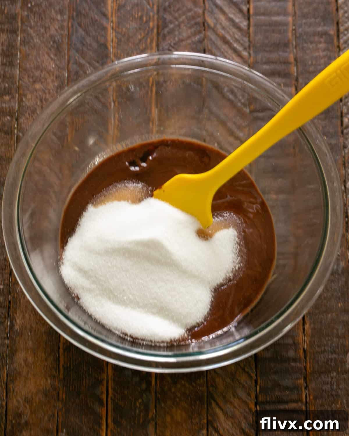 David Lebovitz's Decadent Fudgy Brownies 5 Sugar and vanilla being stirred into the chocolate and butter mixture.