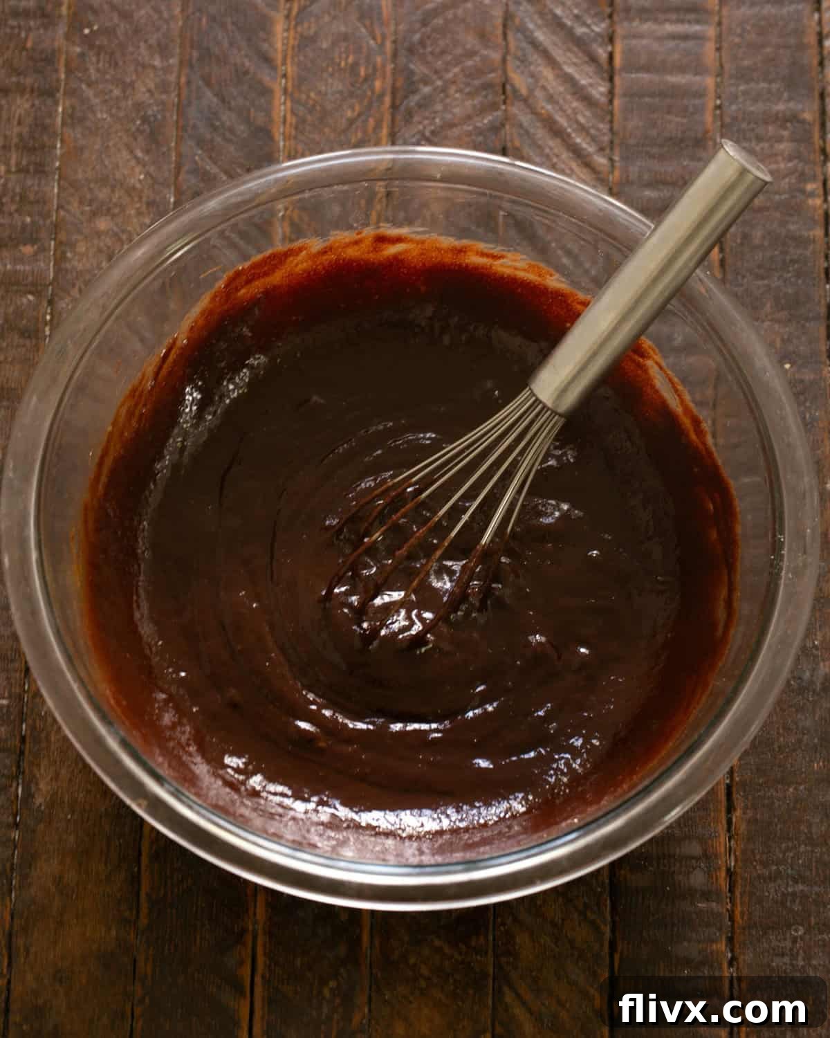 David Lebovitz's Decadent Fudgy Brownies 6 An egg being beaten into the brownie batter, one at a time.