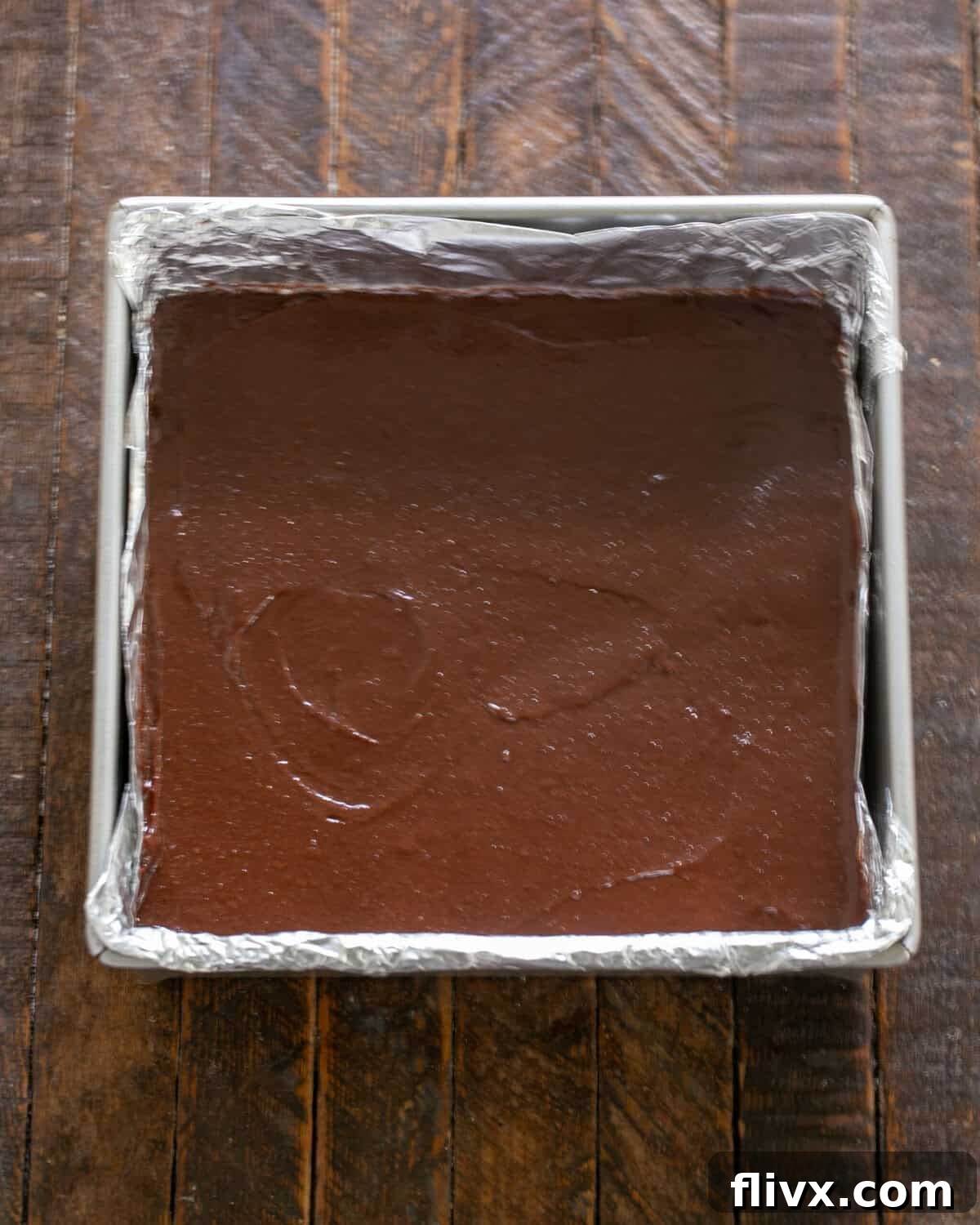 David Lebovitz's Decadent Fudgy Brownies 9 Brownie batter spread into a baking pan, ready for the oven.