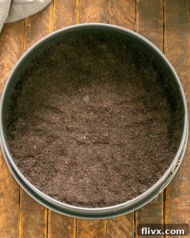 Grasshopper Oreo Freeze 4 Step 1: Making the Oreo crust and pressing it into the pie pan.