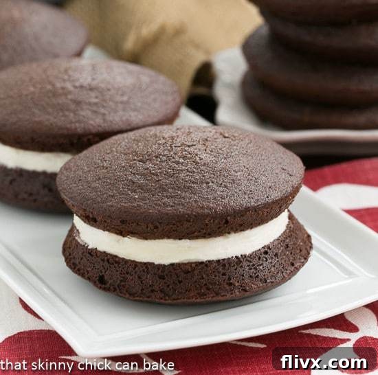 Whoopie pies on a white ceramic platter.