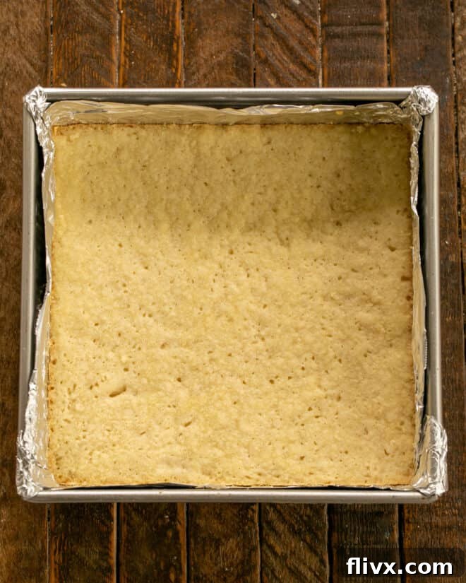 Baked shortbread crust, golden brown and perfectly firm in the baking pan.