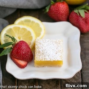 The Best Lemon Bars Recipe: A perfect square of lemon bar dusted with powdered sugar.