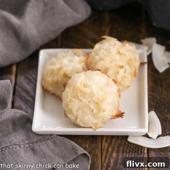 Classic Coconut Macaroons Recipe - The BEST recipe for an old fashioned coconut cookie Classic Coconut Macaroons on a square white plate, perfectly golden brown.