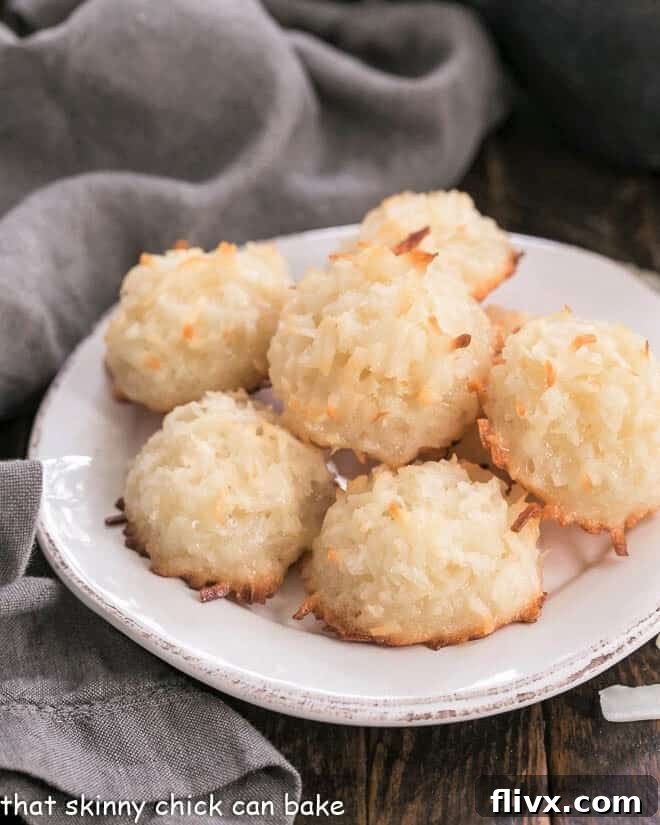 Classic Coconut Macaroons Recipe - The BEST recipe for an old fashioned coconut cookie Classic Macaroon Cookies arranged neatly on a round white plate.