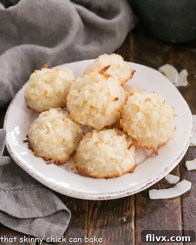Classic Coconut Macaroons - The BEST recipe for an old fashioned coconut cookie Close-up of golden brown Coconut Macaroons on a round white plate.