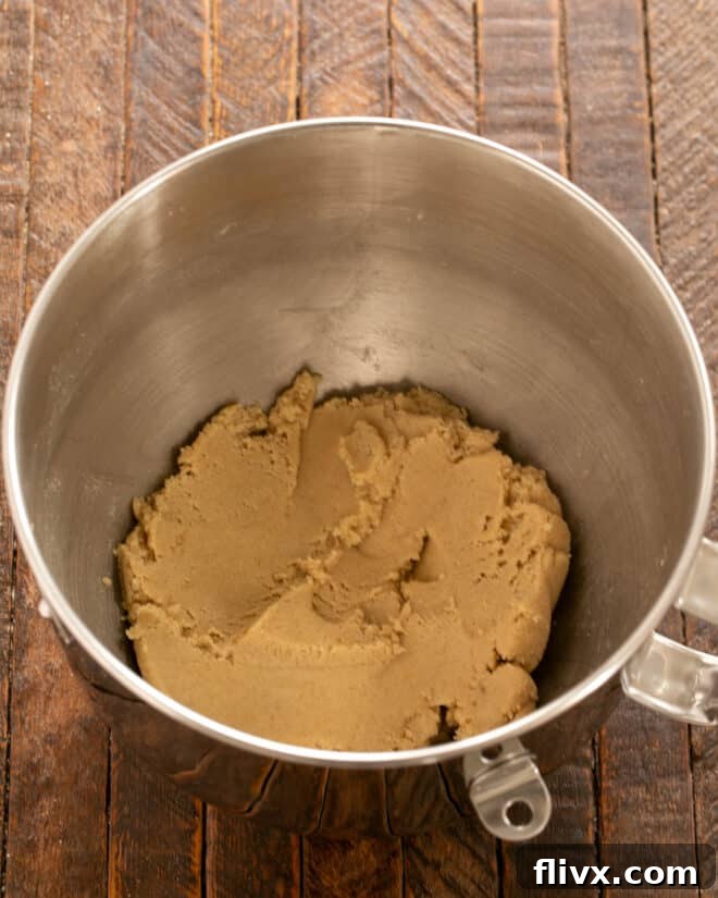 Step 1: Creaming butter and sugars until light and fluffy.