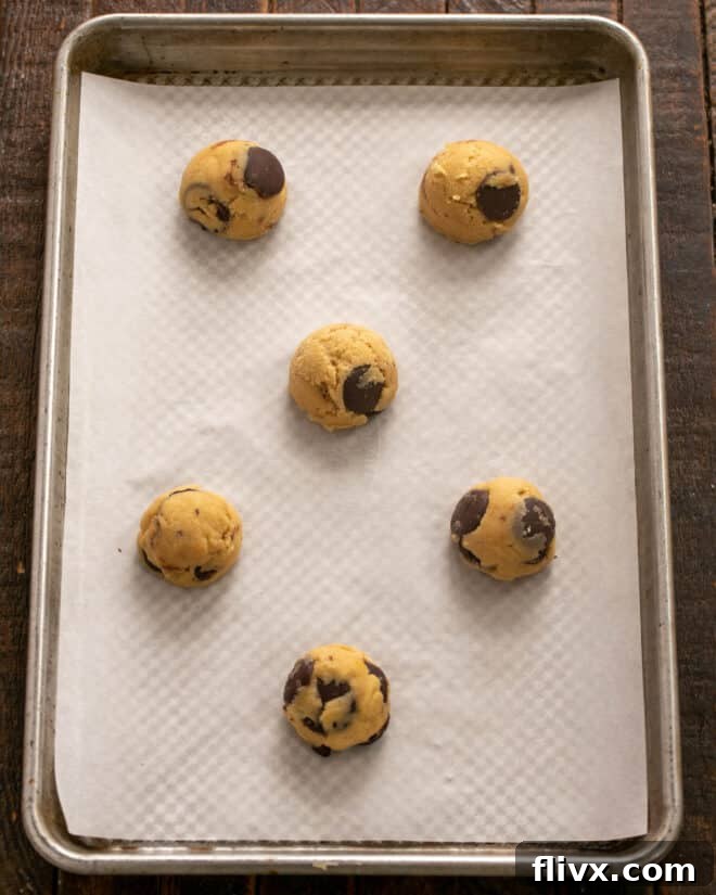 Step 4: Rolling portions of dough into large balls ready for chilling.