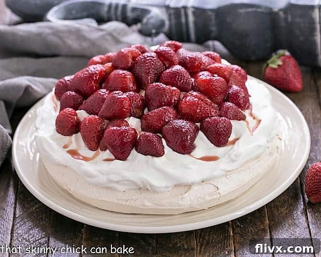 Strawberry Pavlova side view on a white platter