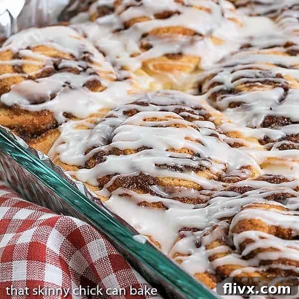 The Best Cinnamon Rolls baked to golden perfection in a Pyrex baking dish, ready to be glazed.