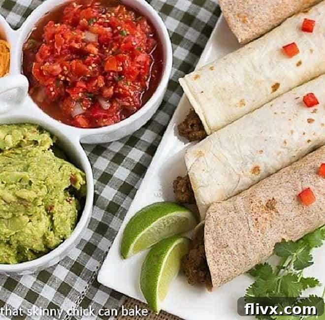 Overhead view of Soft Shell Tacos {Homemade Beef Tacos} on a platter next to toppings, showcasing a vibrant and appealing meal.