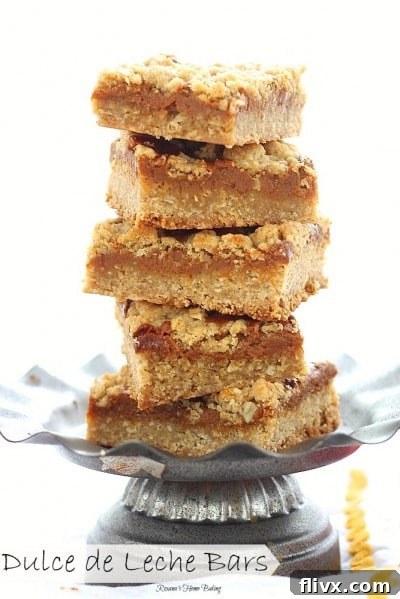 Stack of rich Dulce de Leche Bars on a metal serving dish, ready to enjoy