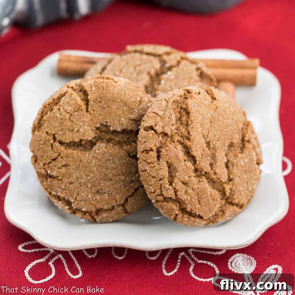 Chewy Gingersnaps on a white plate, a festive addition to any cookie swap.