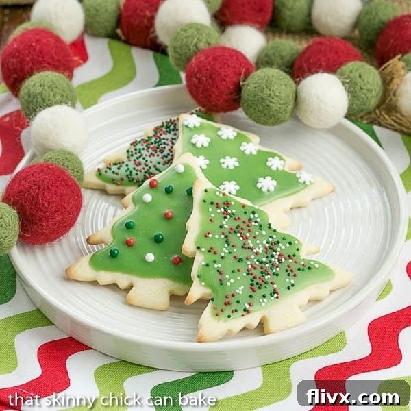 Best sugar cookies on a white plate, perfect for decorating and a Christmas Cookie Exchange.