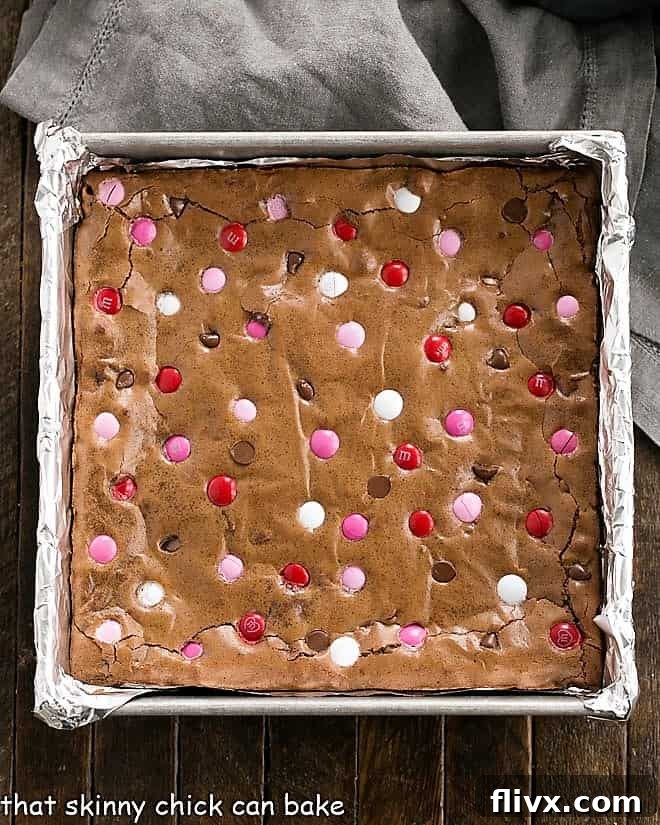 Overhead view of a square pan of the best brownies recipe with M & M's