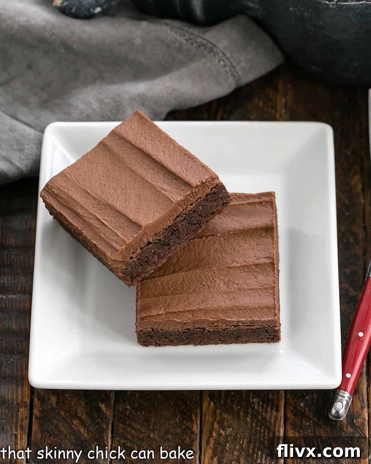 2 Cocoa Brownies on a square white plate.