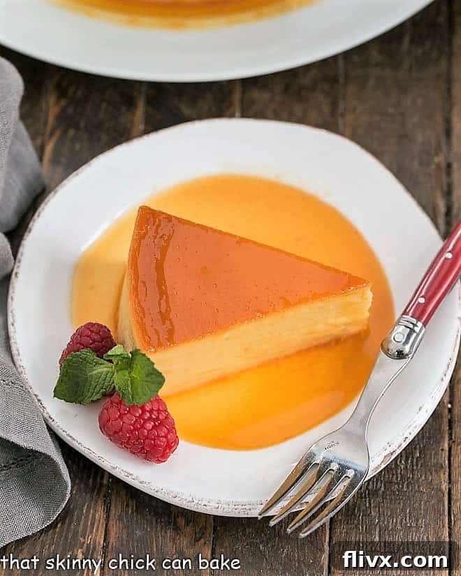 Overhead view of Cream Cheese Caramel Flan Slice in caramel sauce. This rich and dreamy Cream Cheese Caramel Flan is a cross between creme brulee and cheesecake! Totally impossible to resist!