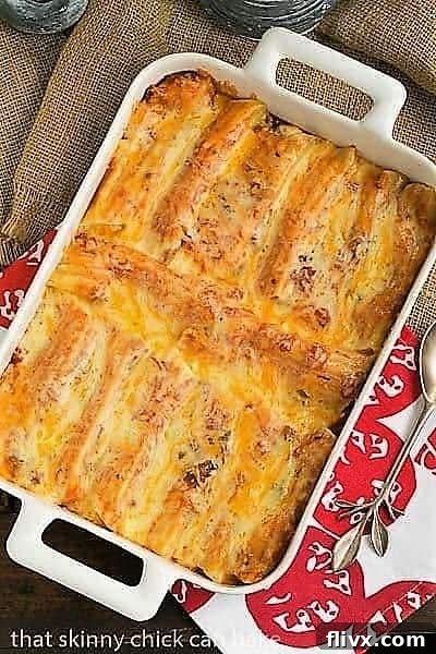 Overhead view of Mexican Manicotti, topped with melted cheese and fresh cilantro