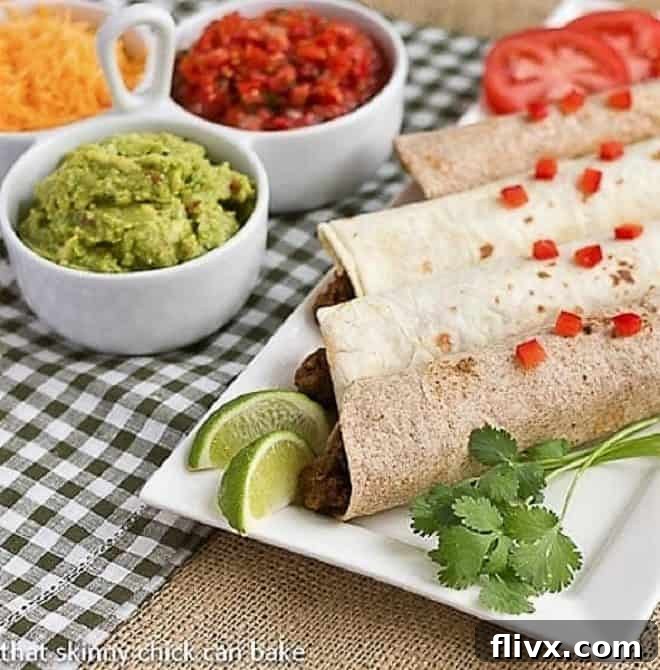 Soft Shell Tacos {Homemade Beef Tacos featured image, with ground beef, cheese, and lettuce in a tortilla