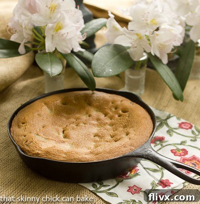 Skillet Chocolate chip cookie cake on a floral napkin, showcasing its appealing texture