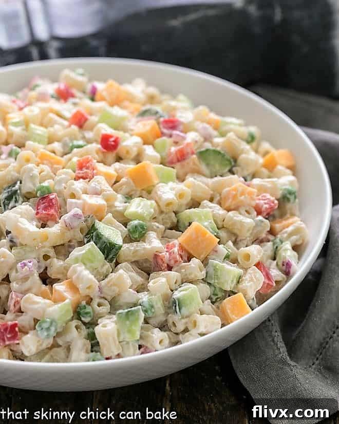 Easy Pasta Salad with Creamy Yogurt Dressing in a rustic white ceramic serving bowl, ready for a summer picnic.