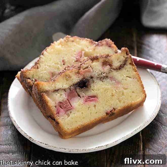 Two enticing slices of the best Rhubarb Bread Recipe, showing a generous cinnamon swirl and moist crumb, ready to be enjoyed.