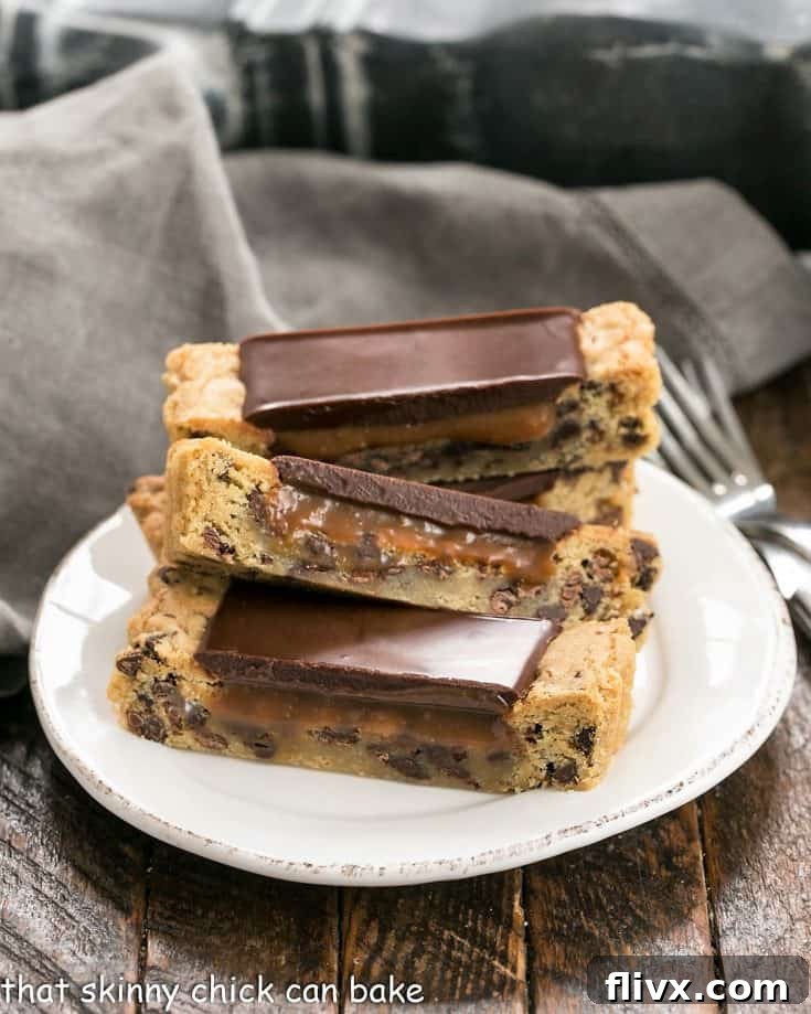 Caramel filled chocolate chip cookie tart slices on a white plate