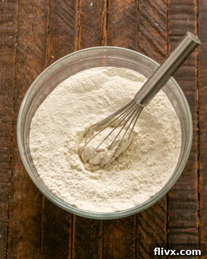 Step 1: Whisk together the dry ingredients – flour, baking soda, and salt in a bowl.