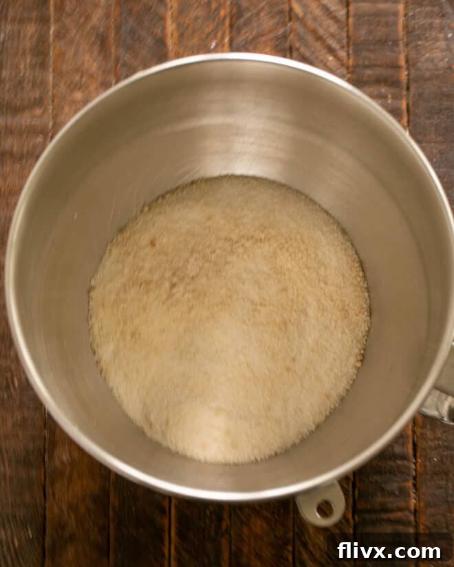 Step 2: Cream together the granulated and brown sugars in a stand mixer.