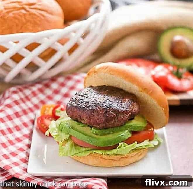 A beautifully plated California Burger with fresh toppings, ready to be enjoyed.