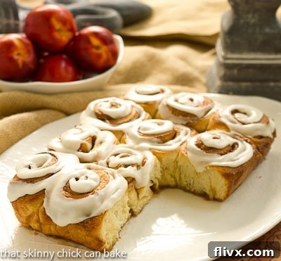 Close-up of Nectarine Cinnamon Rolls showing the juicy fruit and cinnamon swirl.