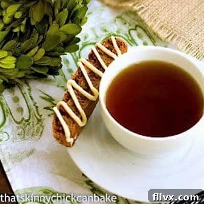 Gingerbread Biscotti on a teacup saucer, elegantly presented for holiday enjoyment