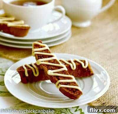 Gingerbread Biscotti on a round white plate, ready to be enjoyed