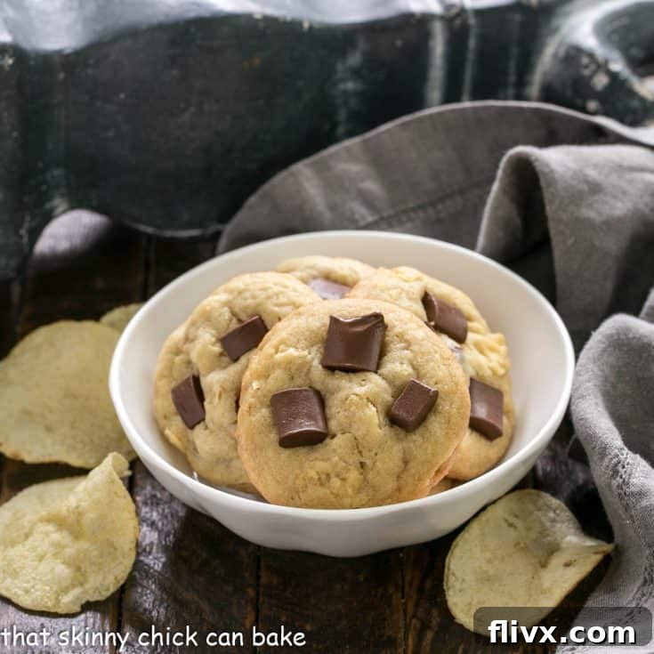 Chocolate Chunk Potato Chip Cookies in a small white bowl, ready to be enjoyed.