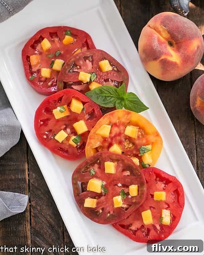 Tomatoes overlapping on a white ceramic platter