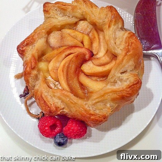 Sweet Apple and Melted Brie Pastry Bake 2 Overhead view of apple topped bake brie in a recipe card context.