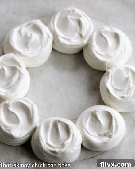 Christmas Cloud Wreath 5 Undecorated pavlova wreath on a parchment lined baking sheet