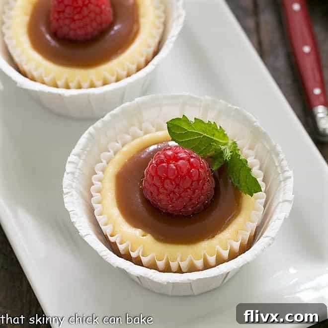 Close overhead view of mini cheesecakes topped with caramel and mint, showcasing the rich texture and elegant presentation.