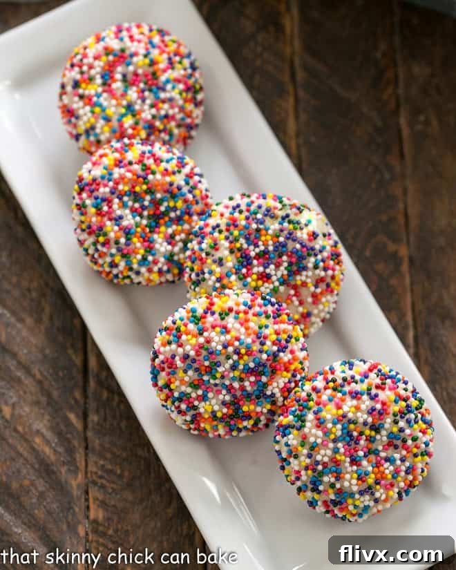 Rainbow Confetti Cookies 2 Sprinkle cookies on a white rectangular tray